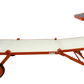 An orange and white adjustable sun lounger with a wheeled base and a small elevated sun shade, shown on a plain white background.