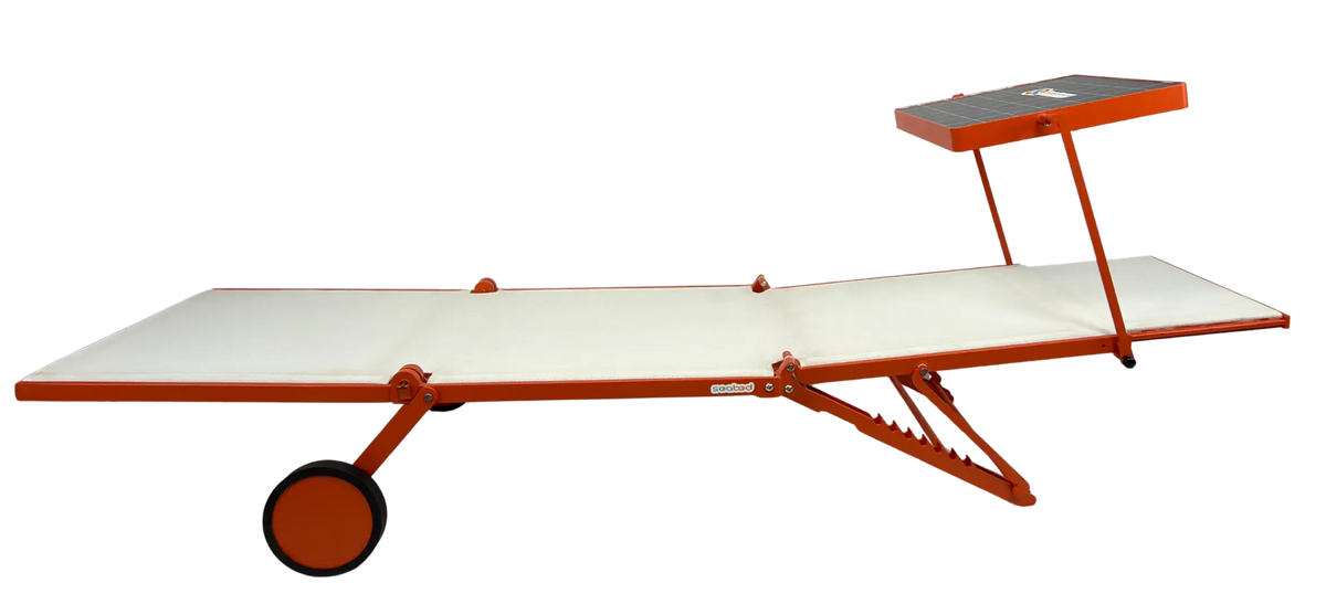 An orange and white adjustable sun lounger with a wheeled base and a small elevated sun shade, shown on a plain white background.