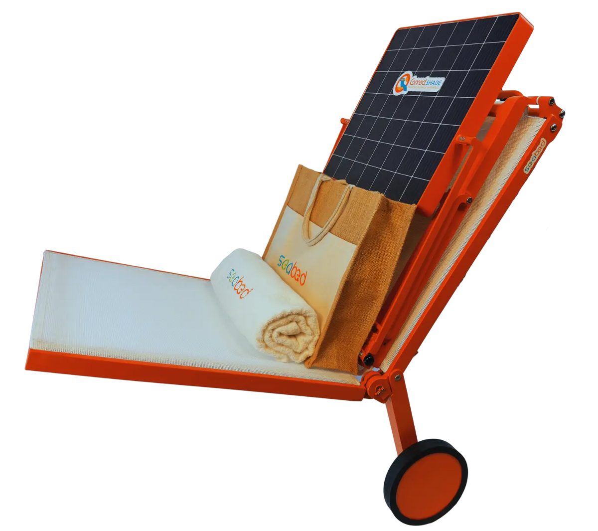 An orange folding solar power cart with a built-in solar panel on the back, shown on a white background with promotional items like a branded shopping bag, a rolled towel, and a small bottle placed on its tray.